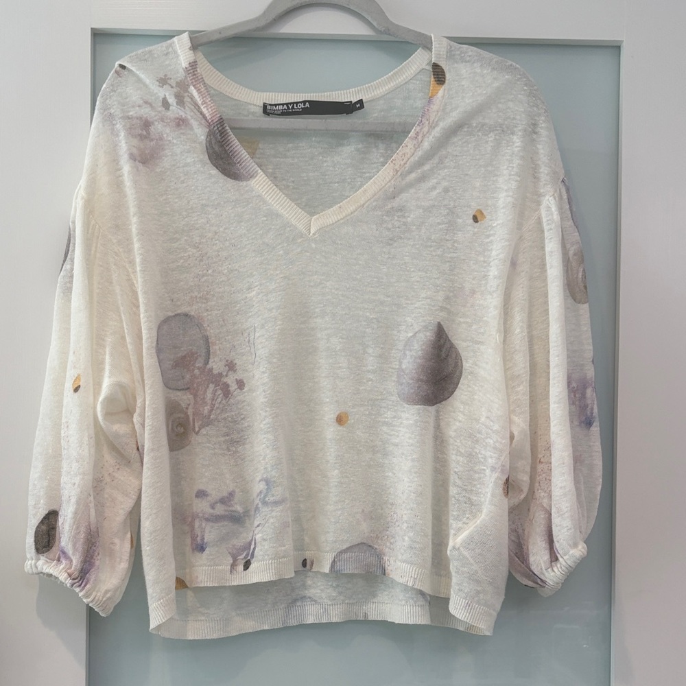 Elegant V-Neck Sweater with Artistic Patterns